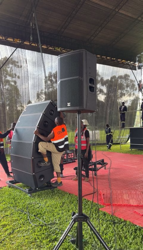 Pro AVL Africa crew assembling a line array on an outdoor stage
